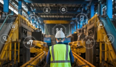 Engineer standing in front of equipment